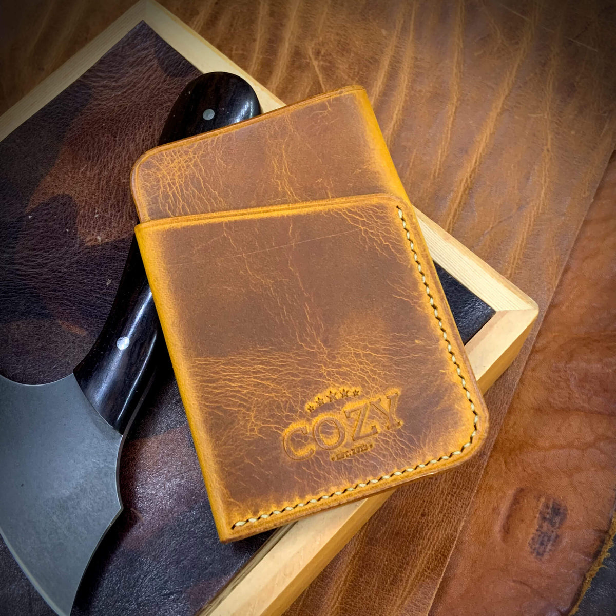 COZY Slim Sleeve Wallet in wax napoli full grain leather, showing COZY stamp and saddle stitching detail