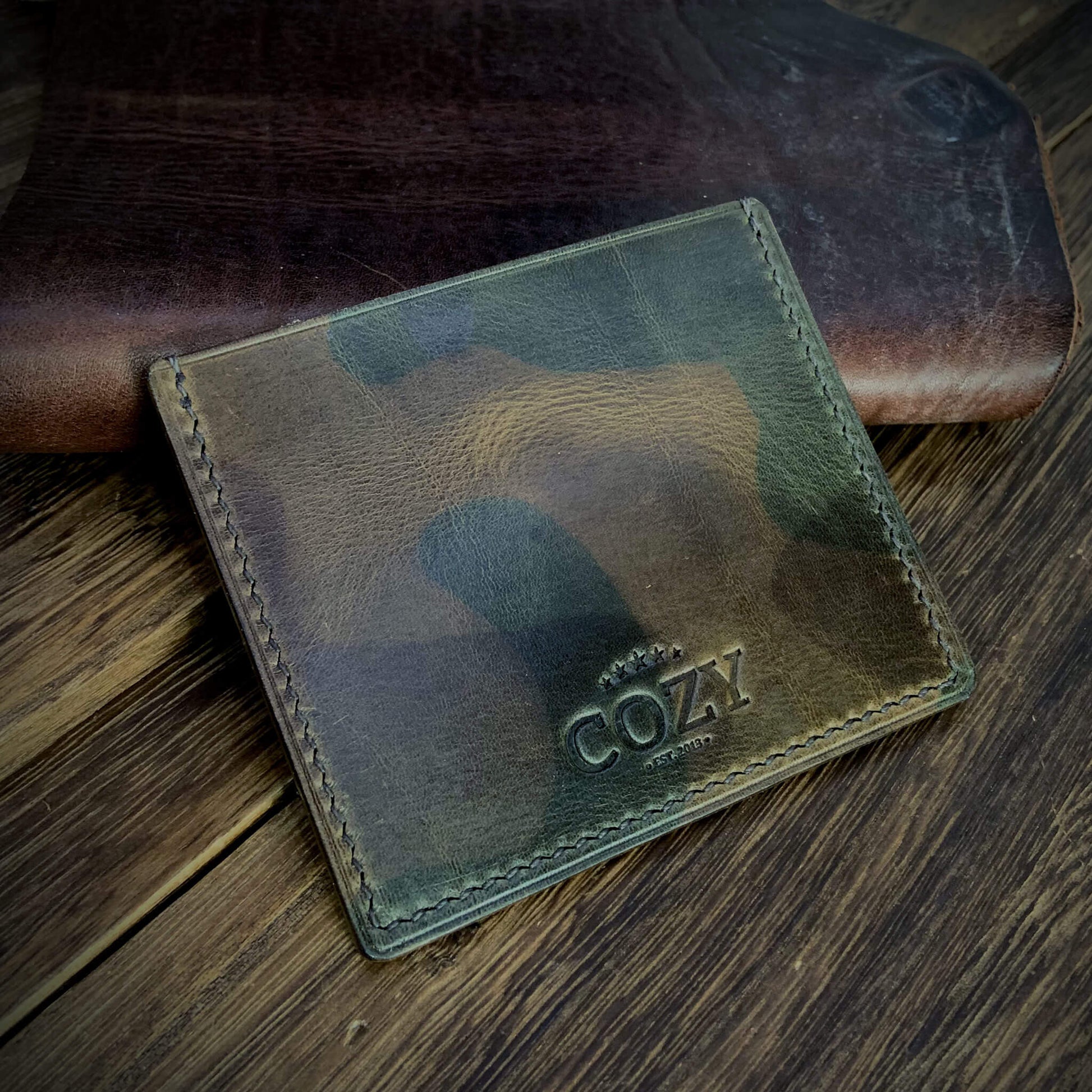 COZY Handmade Everyday Card Wallet in Military 107 showing embossed COZY Est. 2013 stamp — full grain veg tan leather handcrafted in Singapore