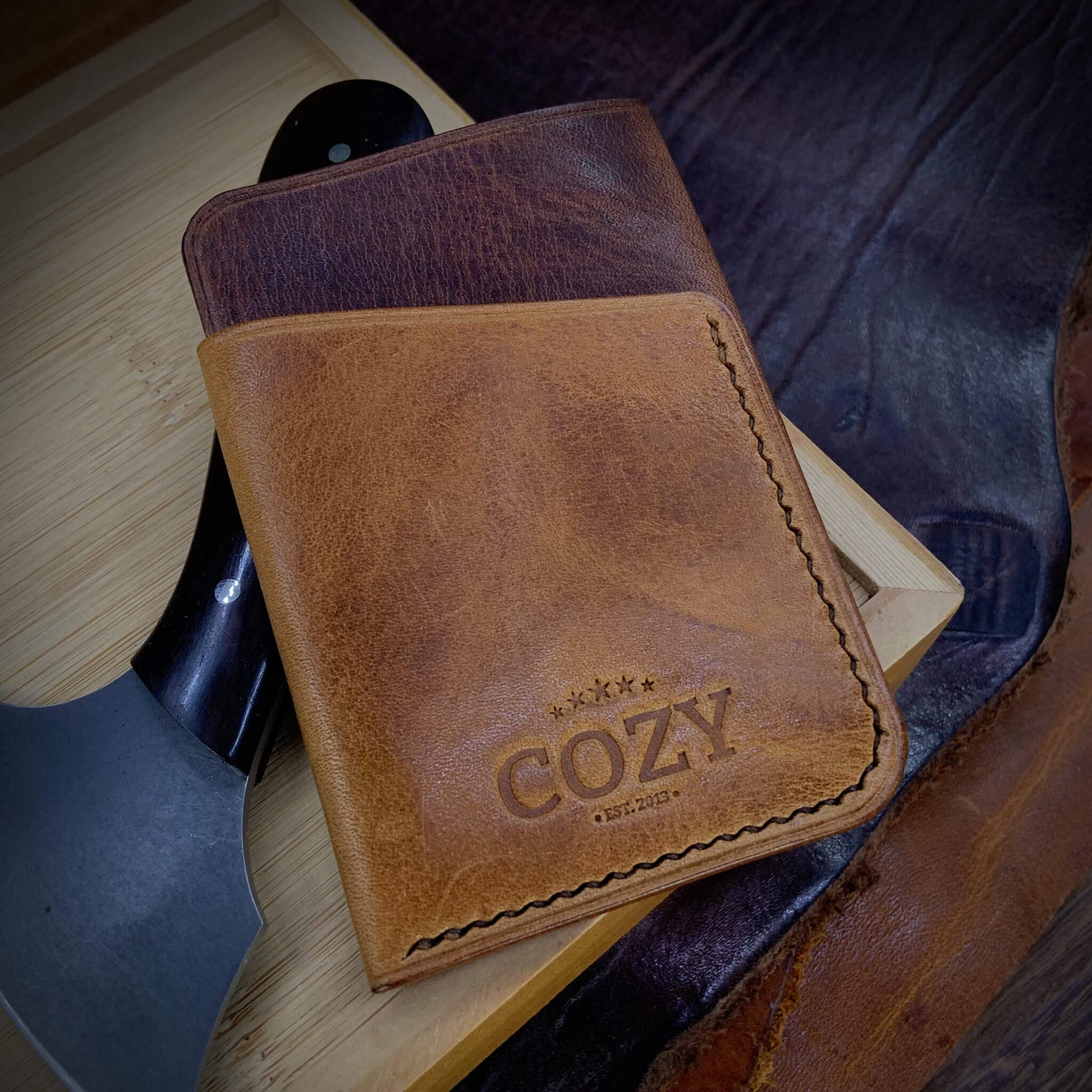 COZY Slim Sleeve Wallet in two-tone dark and tan brown full grain leather, showing COZY stamp and saddle stitching detail