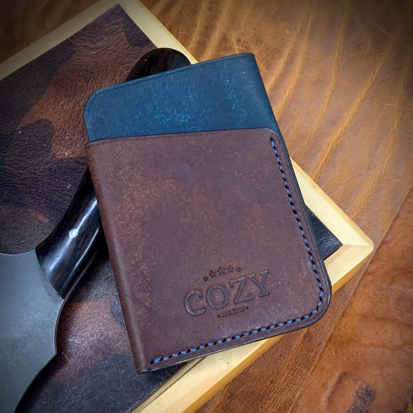 COZY Slim Sleeve Wallet in two-tone pueblo nazionale and tobacco full grain leather, showing COZY stamp and saddle stitching detail