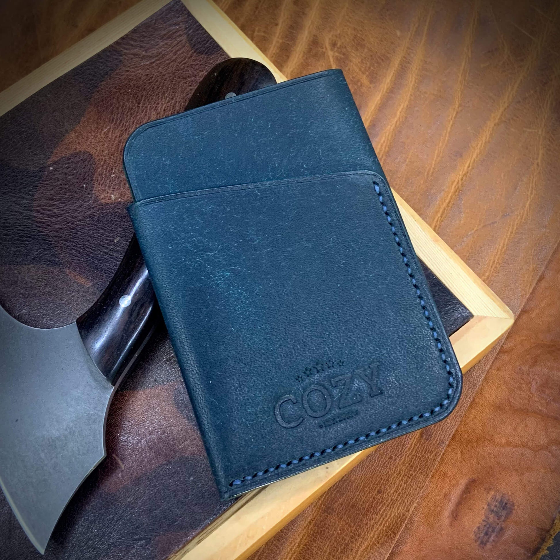 COZY Slim Sleeve Wallet in pueblo nazionale full grain leather, showing COZY stamp and saddle stitching detail