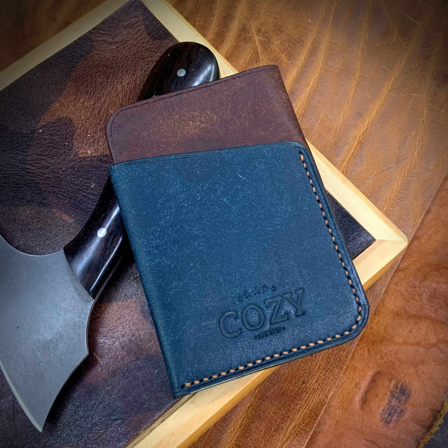 COZY Slim Sleeve Wallet in two-tone pueblo tobacco and nazionale full grain leather, showing COZY stamp and saddle stitching detail