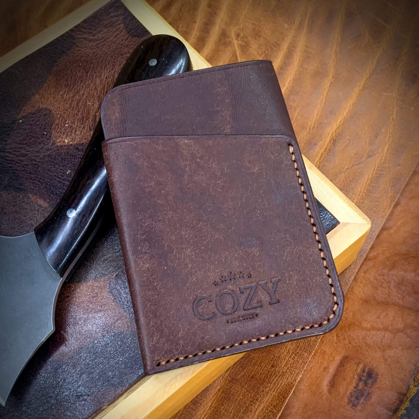 COZY Slim Sleeve Wallet in pueblo tobacco full grain leather, showing COZY stamp and saddle stitching detail