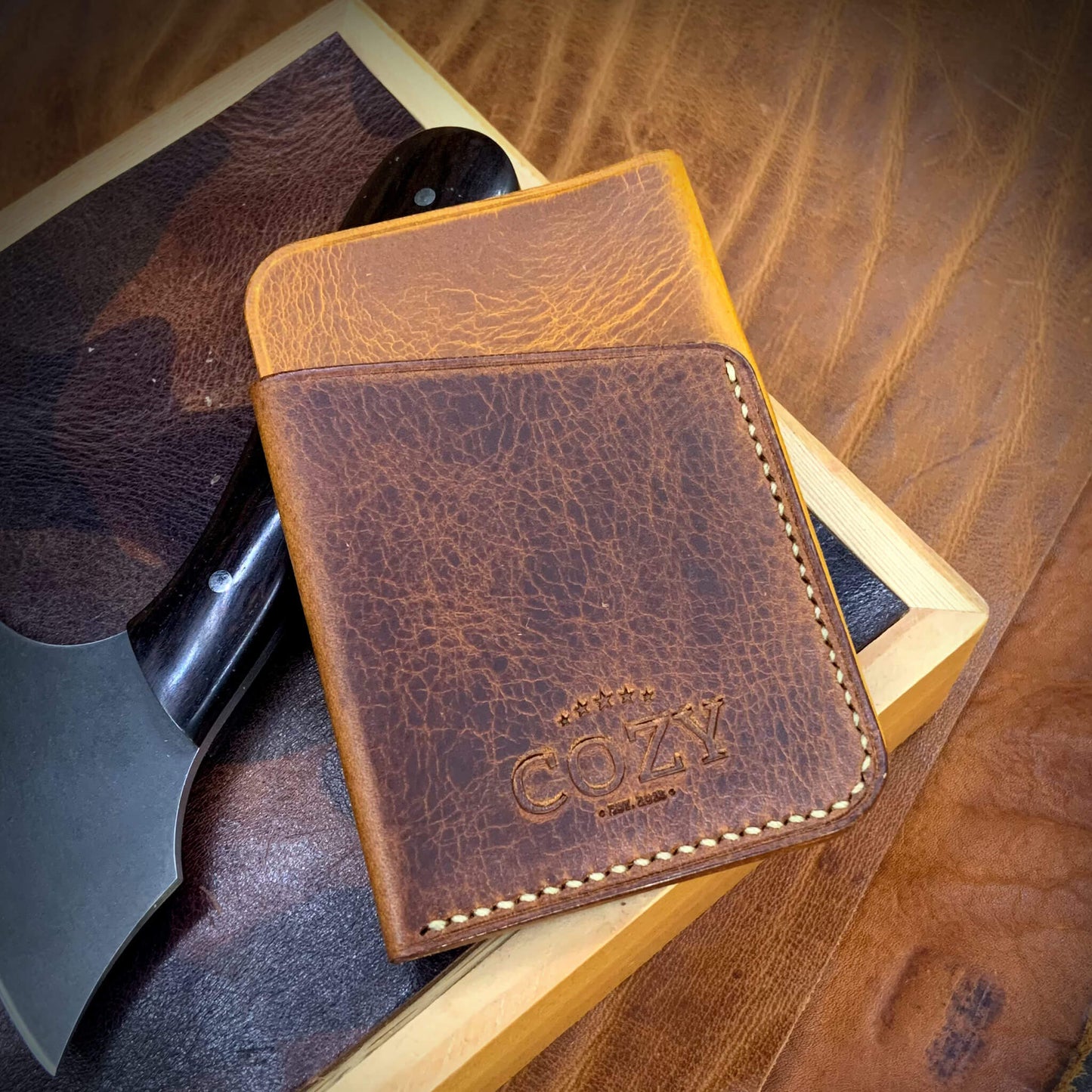 COZY Slim Sleeve Wallet in two-tone wax napoli and gognac full grain leather, showing COZY stamp and saddle stitching detail