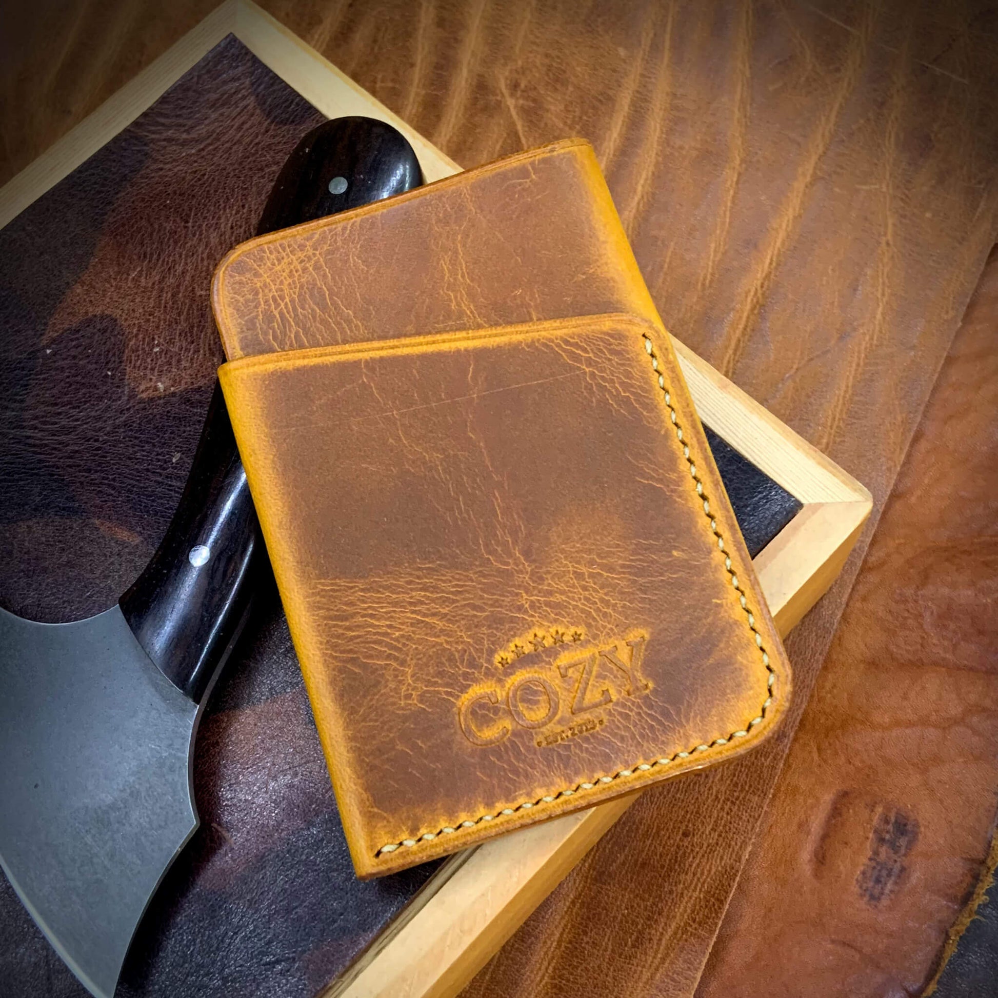 COZY Slim Sleeve Wallet in wax napoli full grain leather, showing COZY stamp and saddle stitching detail
