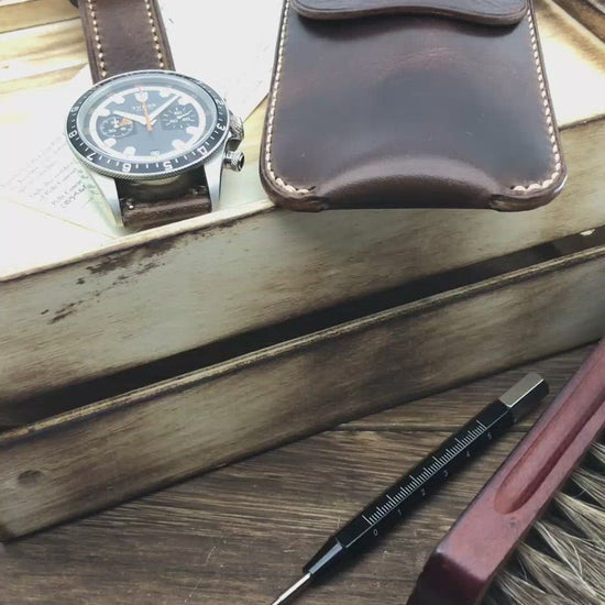 Close-up video highlighting the hand-stitched details and premium Italian leather of a military dark brown single watch slip case by Cozy Handmade