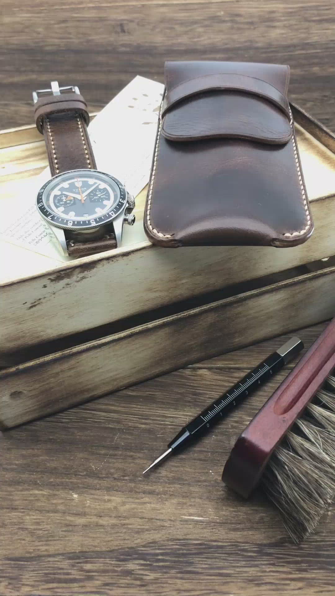 Close-up video highlighting the hand-stitched details and premium Italian leather of a military dark brown single watch slip case by Cozy Handmade