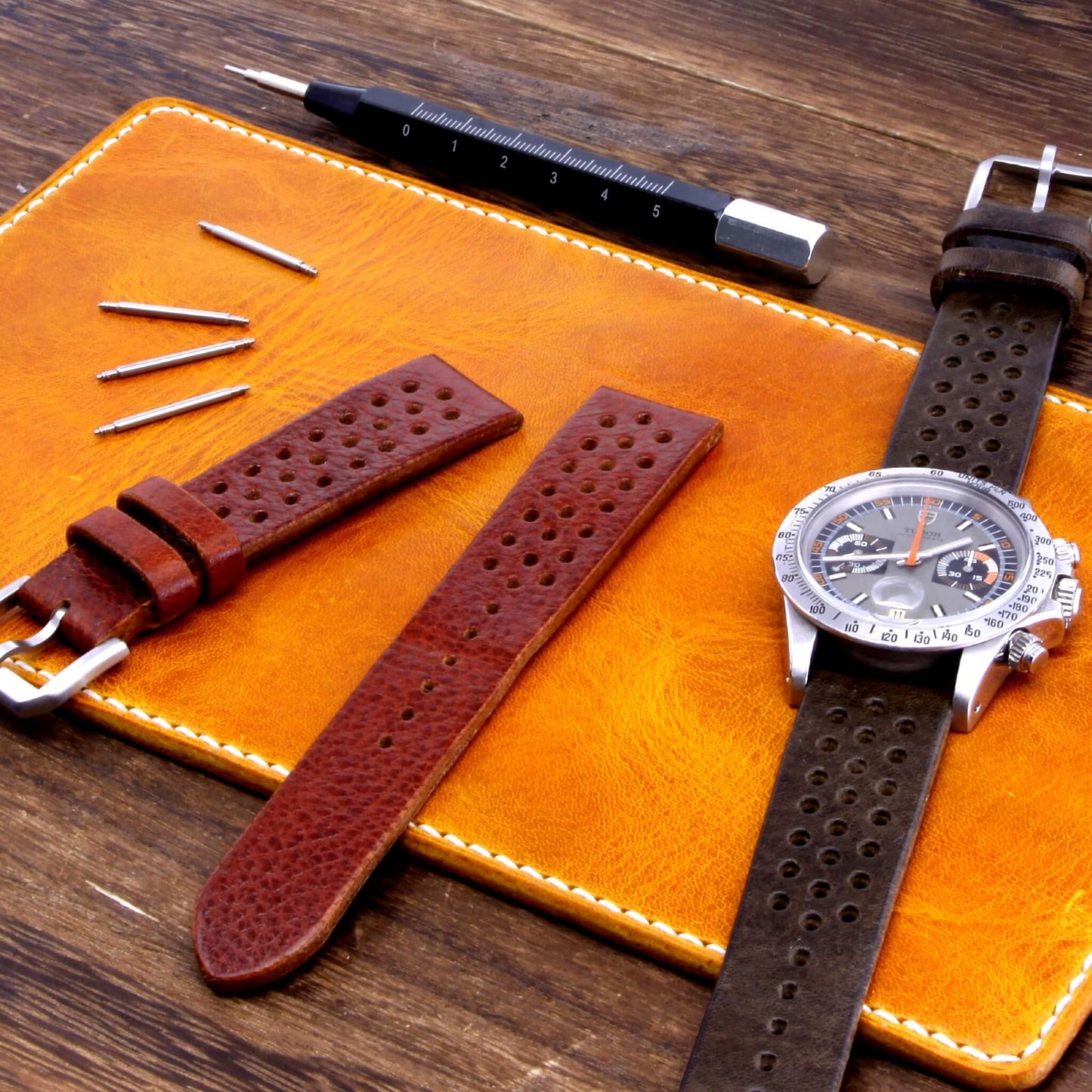 Handcrafted Leather Watch Valet, Military 104 (yellow / orange) Italian vegetable-tanned leather with luxury watch and straps resting on it — Cozy Handmade