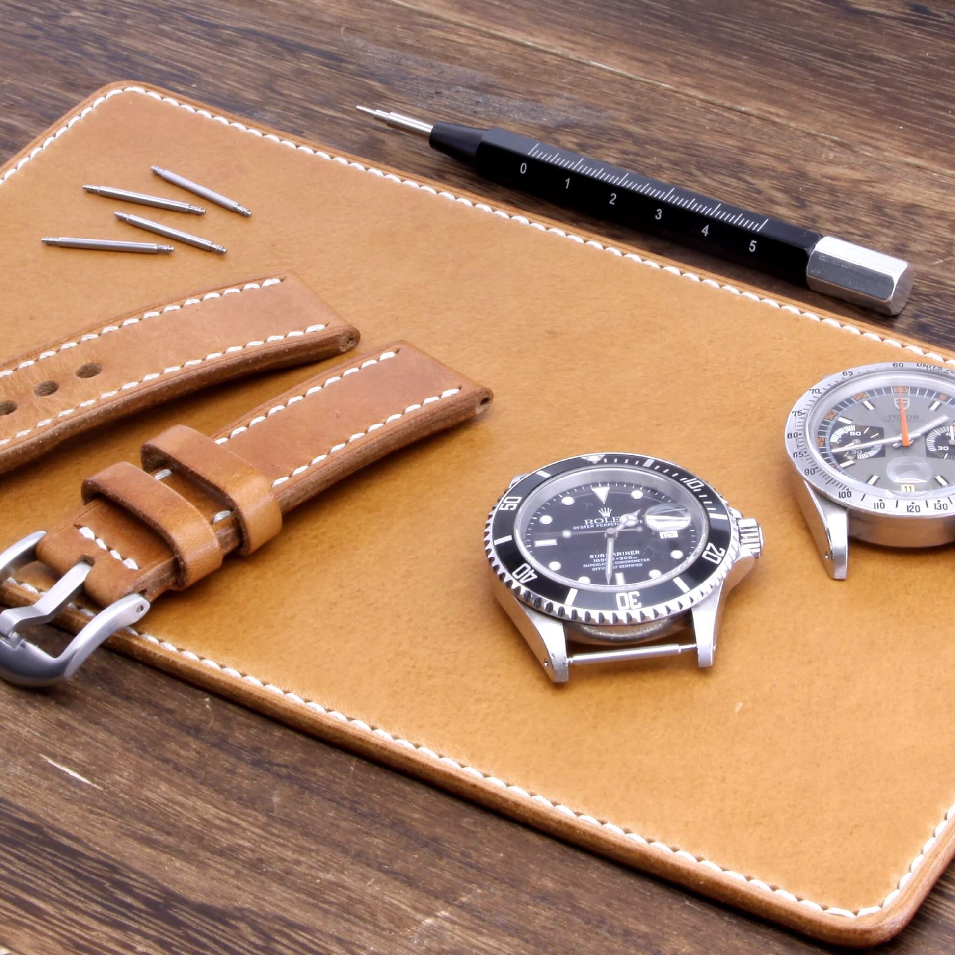 Handcrafted Leather Watch Valet, Sequoia 101 (brown) Italian vegetable-tanned leather with luxury watches and strap resting on it — Cozy Handmade