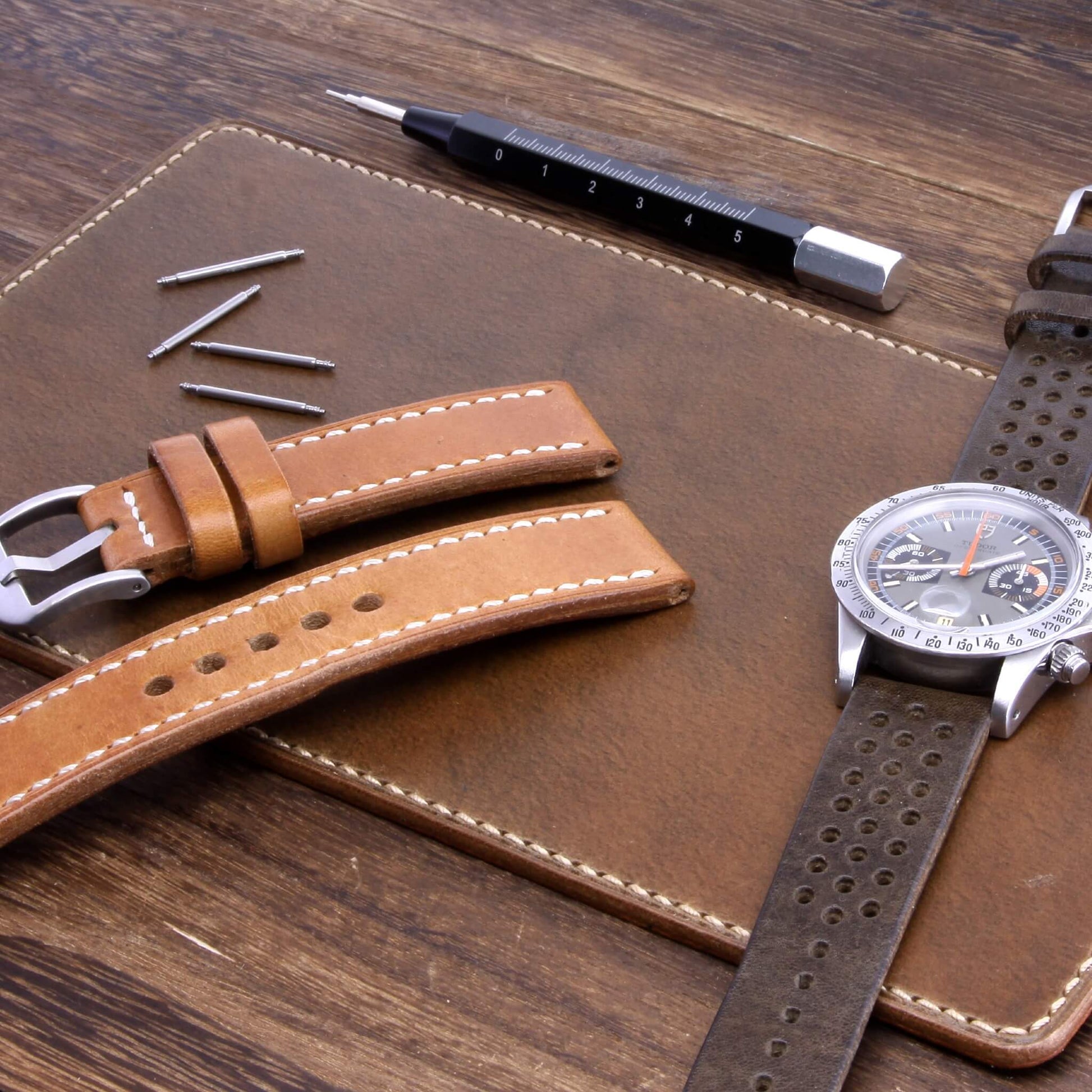 Handcrafted Leather Watch Valet, Sequoia 104 (chocolate brown) Italian vegetable-tanned leather with luxury watches and strap resting on it — Cozy Handmade