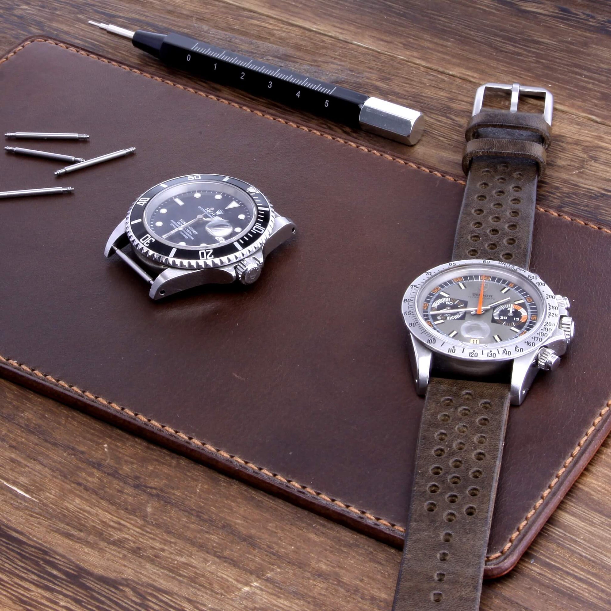 Handcrafted Leather Watch Valet in Sequoia 106 (dark reddish brown) Italian vegetable-tanned leather with luxury watches and strap resting on it — Cozy Handmade